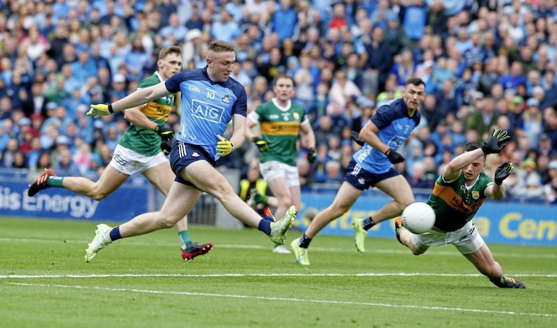 Dublin&#39;s Paddy Small scoring his goal despite the best efforts of Kerry's Paul Murphy. Pic Philip Walsh