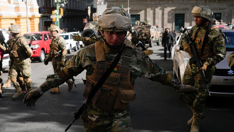 A soldier gestures for journalists to leave Plaza Murillo (Juan Karita/AP)