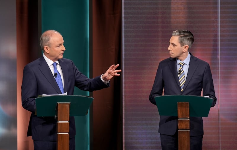 Tánaiste and leader of Fianna Fáil, Micheál Martin (left), and Taoiseach and leader of Fine Gael, Simon Harris, during the general election leaders' debate at RTÉ studios in Montrose, Dublin