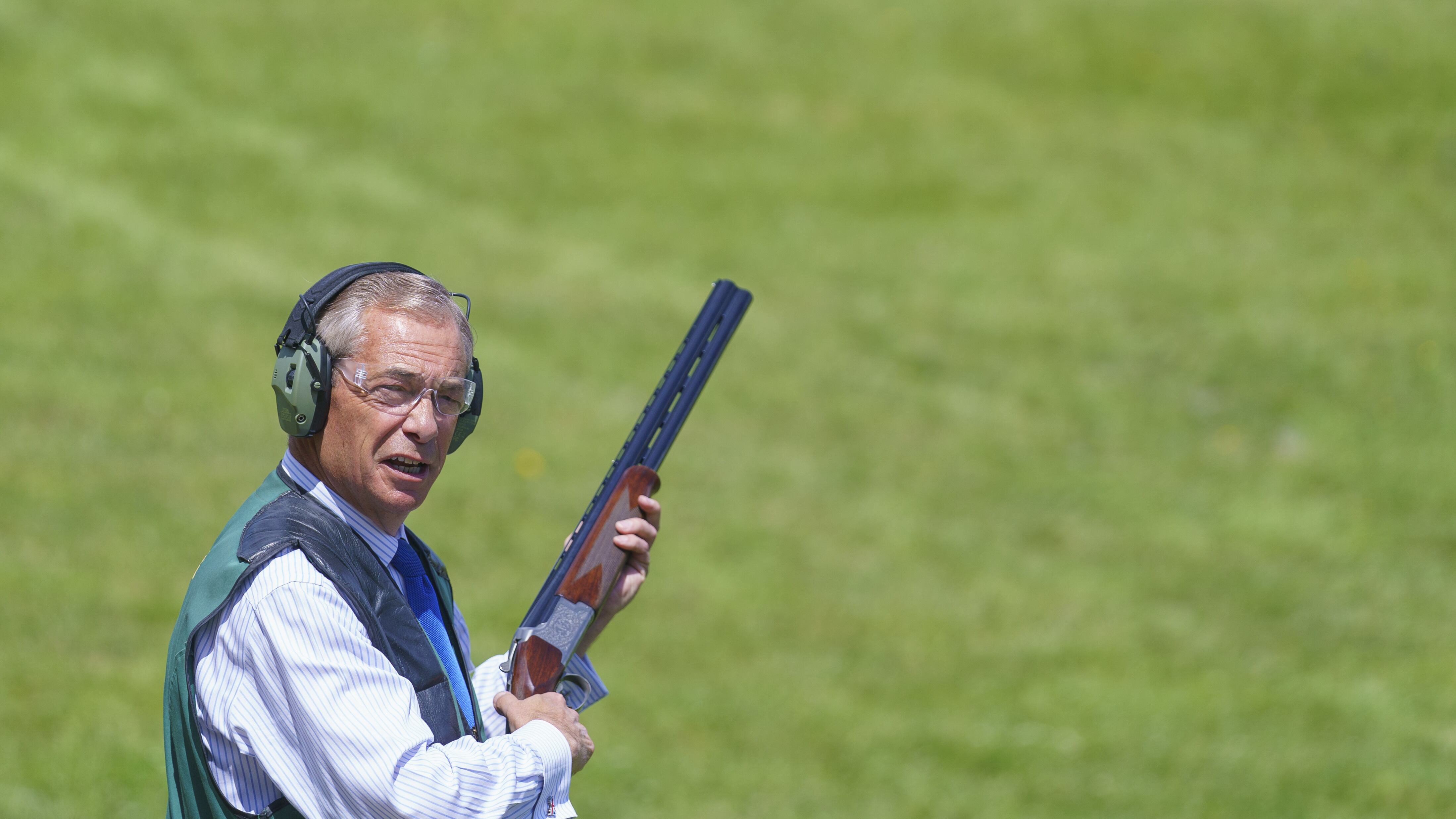 Reform UK leader Nigel Farage takes part in clay pigeon shooting during a visit to Catton Hall in Frodsham, Cheshire