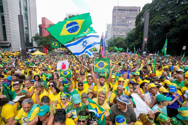 Followers of former Brazilian President Jair Bolsonaro rally to express their support for him in Sao Paulo (Andre Penner/AP)