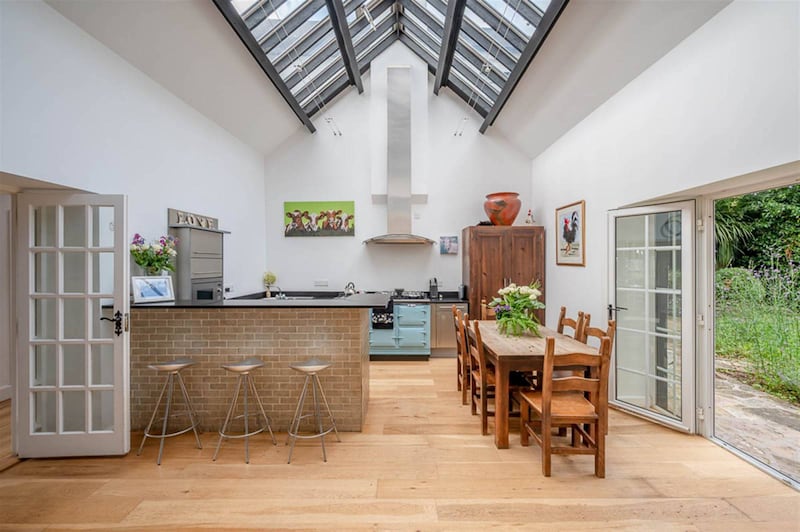 The fabulous dining room with wood burning stove, while the kitchen is complemented with an Aga oil fired range