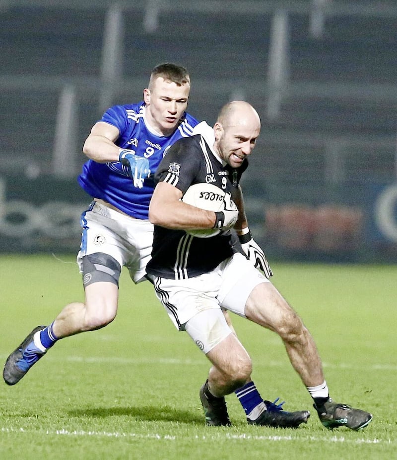 Magheracloone&#39;s Gavin Doogan (front) is challenged by Galbally Pearse&#39;s Enda McGarrity. Pic Philip Walsh 