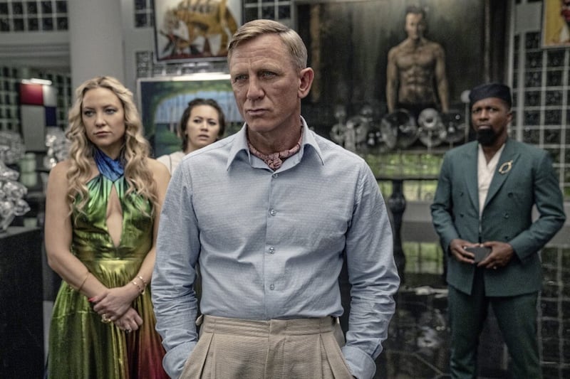 Glass Onion: A Knives Out Mystery gives the whodunnit a modern update. Pictured, left to right, are Kate Hudson as Birdie, Jessica Henwick as Peg, Daniel Craig as Detective Benoit Blanc and Leslie Odom Jr. as Lionel 