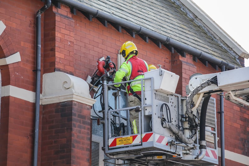 Merseyside Fire & Rescue service help repair a broken window at Southport Islamic Centre Mosque