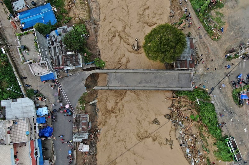 In this aerial image of the Kathmandu valley, the Bagmati River is seen in flood due to heavy rains. (AP Photo/Gopen Rai)