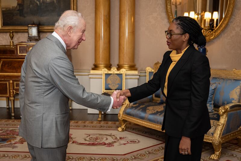 The King and Kemi Badenoch shake hands at the start of the audience