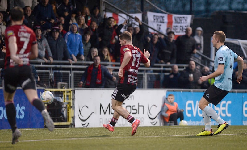 Crusaders Kieran Offord taps home the opener against Cliftonville