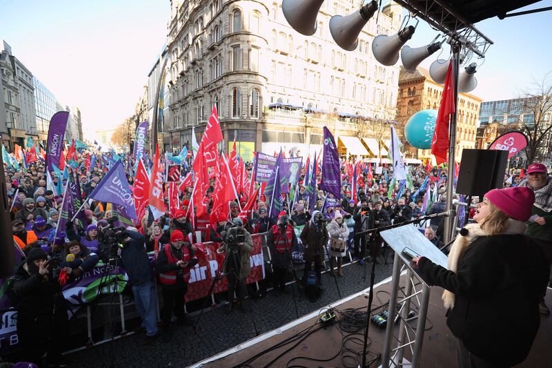 Striking public sector staff at Belfast City Hall in January when an estimated 150,000 workers took part in walkouts over pay