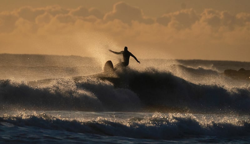 Surfers at Tynemouth Longsands beach on the North East coast