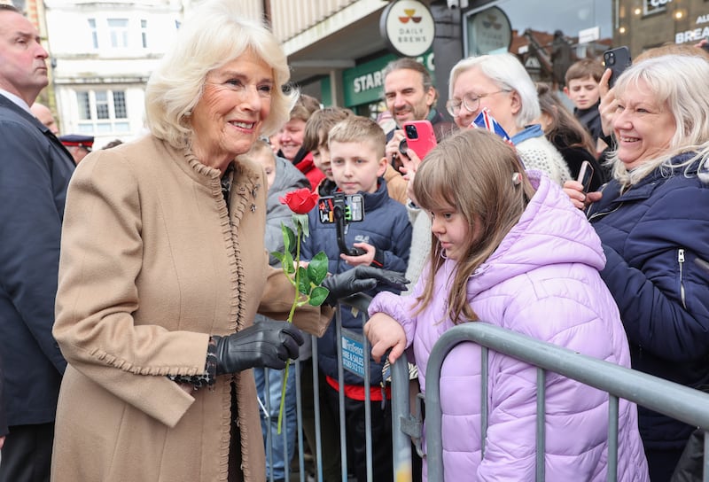 Camilla smiles after receiving a red rose during a visit to the Farmers’ Market in The Square, Shrewsbury, in Shropshire in March