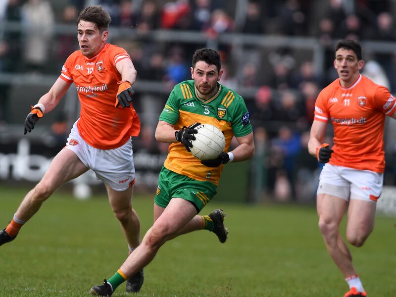 Donegal's Ryan McHugh with Armagh's Andrew Murnin and Rory Grugan. Picture: John Merry