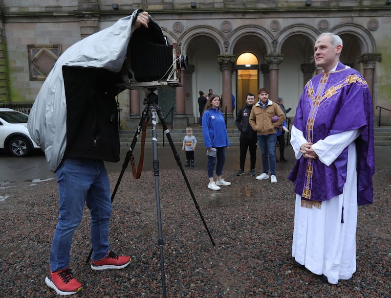 Fr Dominic McGrattan is photographed by Photographer Greg Miller from America,  who has taken pictures of people on Ash Wednesday for the past 30 years , after a mass at Elmwood Hall at Queen’s University.
PICTURE COLM LENAGHAN