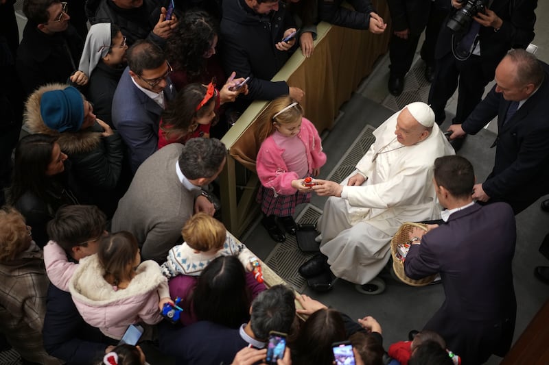 Francis exchanges season greetings with Vatican employees and their families (Andrew Medichini/AP)