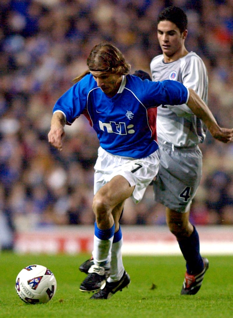 Mikel Arteta in action for PSG in a UEFA Cup match against Rangers .