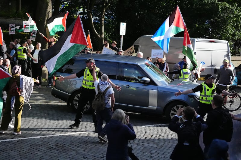 Pro-Palestinian protesters as the car convoy carrying Prime Minister Sir Keir Starmer left Bute House in Edinburgh