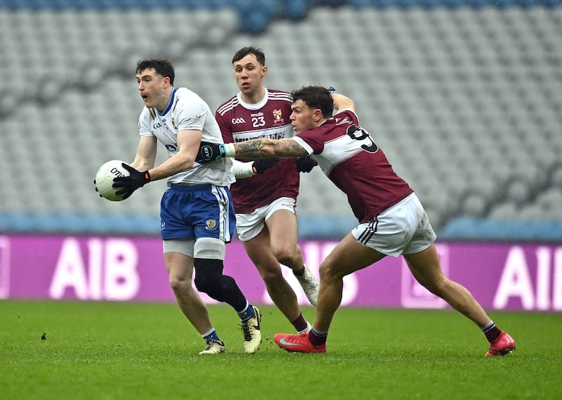 Gareth McKinless of Ballinderry in action against Lorcan Loftus and Jordan Flynn of Crossmolina in the All Ireland Club Intermediate championship Final  at Croke Park, Dublin