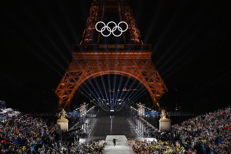 Former French footballer Zinedine Zidane with the Olympic Flame during the opening ceremony of the Paris 2024 Games. Picture by PA