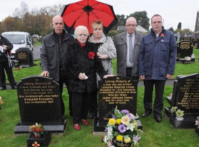 Pictured at Winston Cross' grave 10 years ago, (l-r) his sister Sharon, mother Blanche, and brothers Vance and Harry.