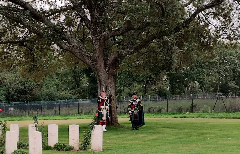 A bugler and piper were present at the rededication service