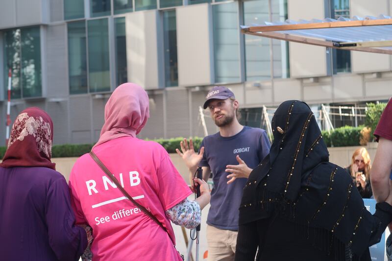 Man talking to group of people