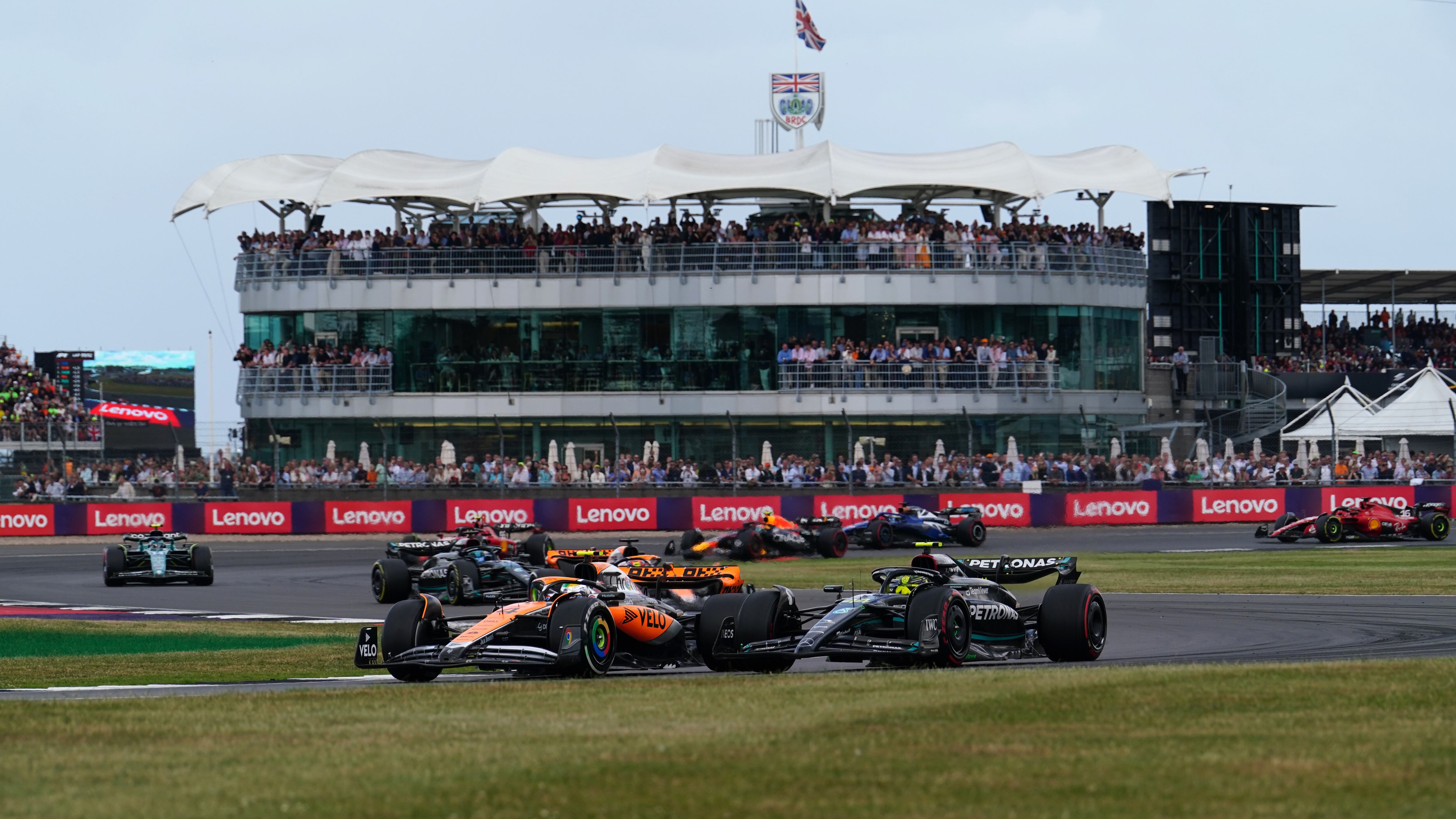 McLaren’s Lando Norris leads Mercedes’ Lewis Hamilton around Luffield in the 2023 British Grand Prix