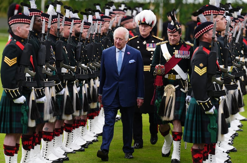 Charles walks through a guard of honour in the Ceremony of the Keys on the forecourt of the Palace of Holyroodhouse in Edinburgh