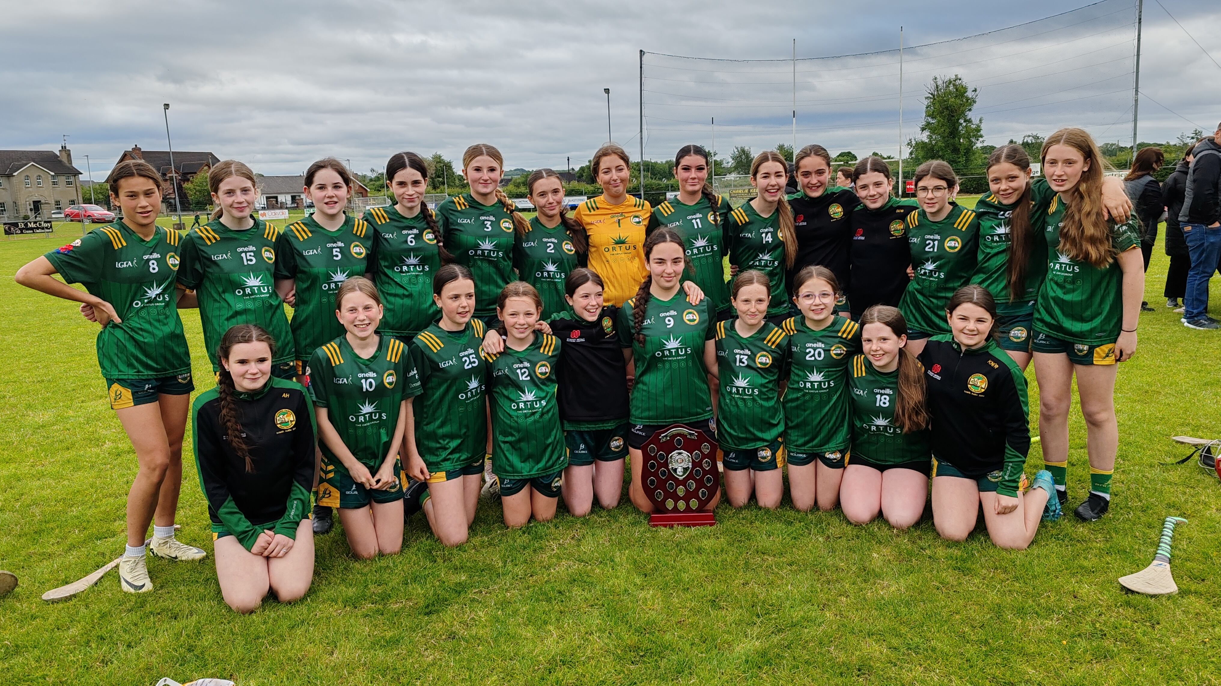 The victorious Coláiste Feirste team with the Sciath Aoife trophy