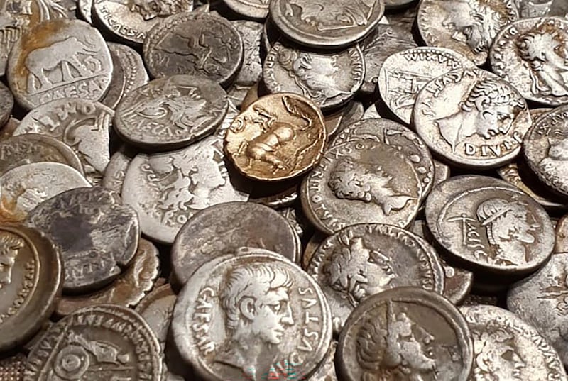 Coins discovered by metal detectorist George Ridgway, who was inspired by Indiana Jones, have sold at auction for £132,865