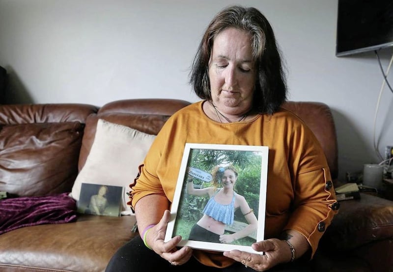 Andrea Brannigan-McLaughlin hold a picture of her daughter Danielle 