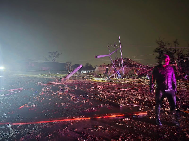 A person surveys the damage after a tornado hit Midwest City, Oklahoma (Sean Taylor via AP)