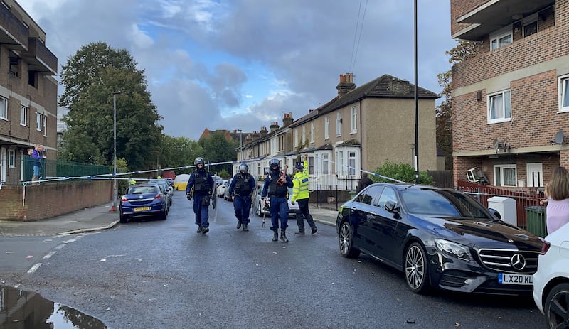 Officers at the scene in Eglinton Road, Woolwich, south-east London