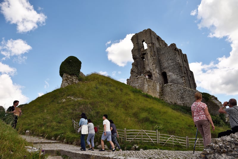 Visitors at Corfe Castle, Dorset. (National Trust)