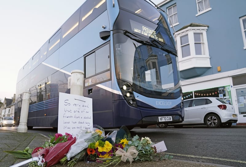 Flowers left at the entrance at Portland Port in Dorset following the death of an asylum seeker on board the Bibby Stockholm in December