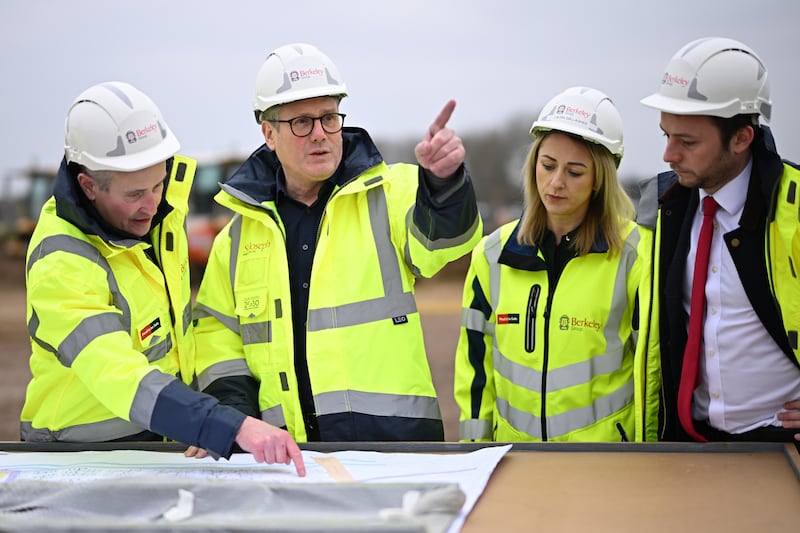 Prime Minister Sir Keir Starmer (second left) was forced to cut short the visit to a housing development