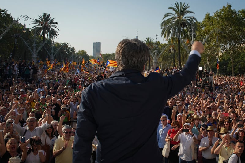 Catalan independence leader Carles Puigdemont addresses supporters near the Catalan parliament in Barcelona on Thursday (Emilio Morenatti/AP)