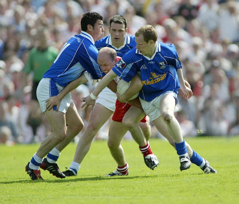 No way out.....Tyrone's Peter Canavan  surrounded by cavan's Mark Mckeever, peter reilly and keith fannin during yesterday's Ulster Championship semi-final in Clones. The match ended in a draw. Pic Ann McManus  19-6-05