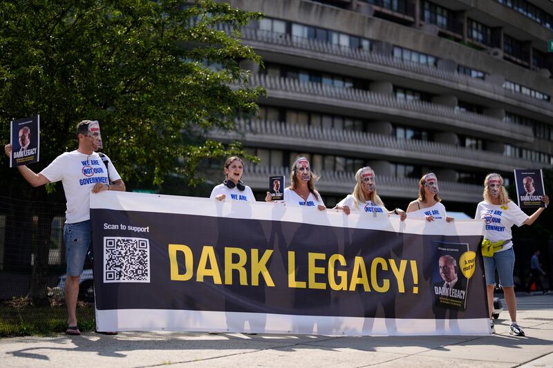 Protesters near The Watergate Hotel in Washington DC (Matt Slocum/AP)