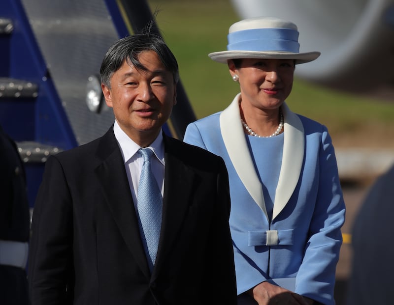 Emperor Naruhito and Empress Masako of Japan getting off a plane