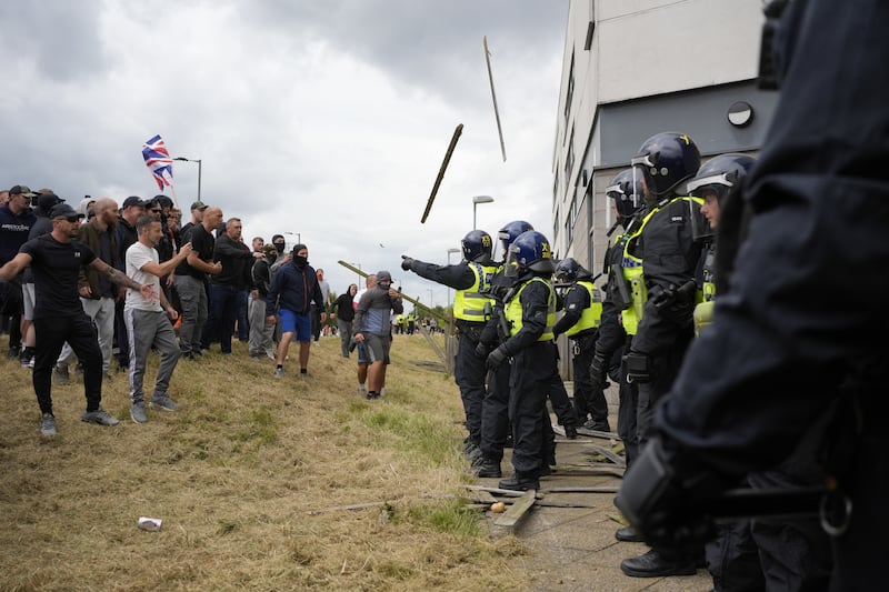 Violent protesters and police clashed outside Holiday Inn Express, Rotherham, on Sunday, August 4