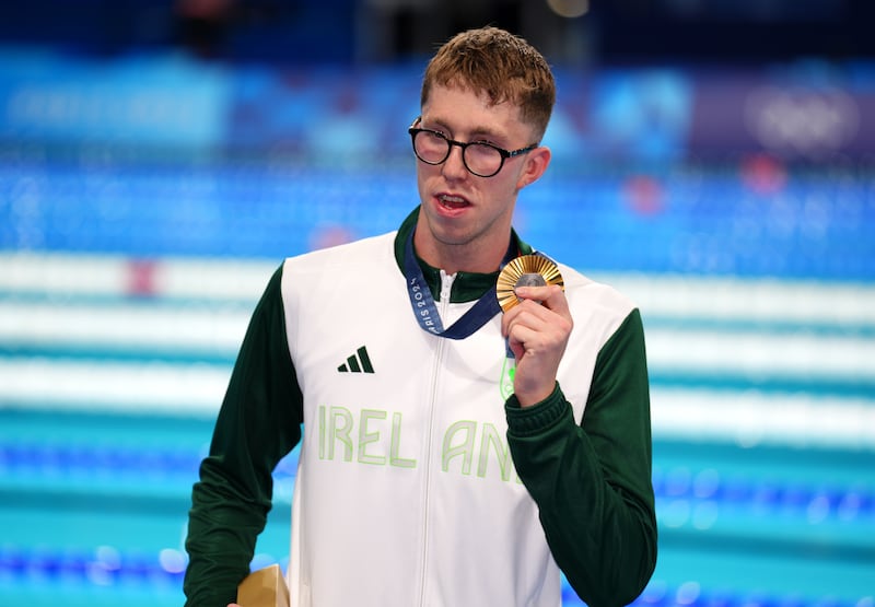 Ireland’s Daniel Wiffen poses with his gold medal after winning the men’s 800m freestyle