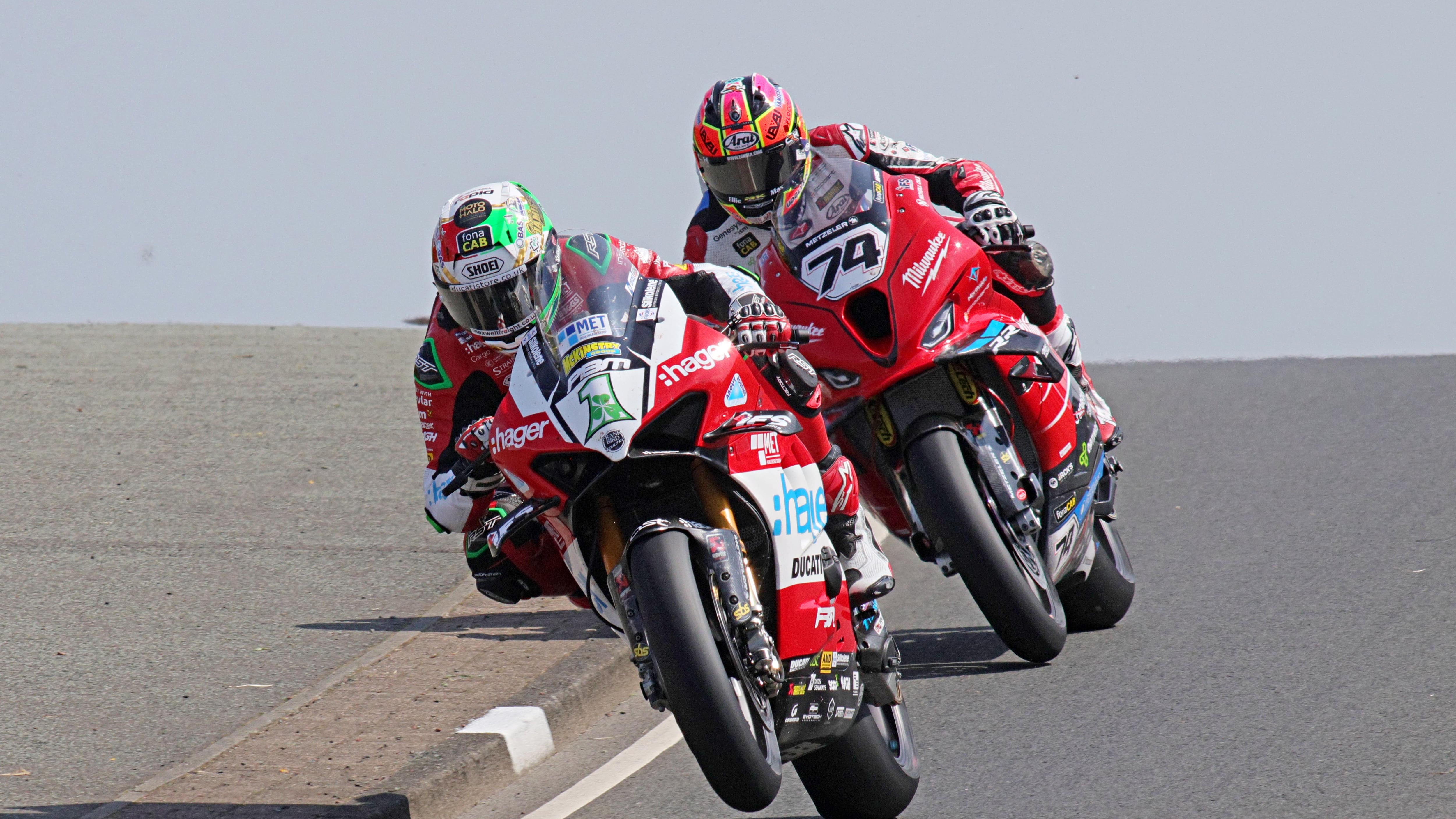 Glenn Irwin holds off the challenge of Davey Todd to win the first Superbike race on Saturday at the North West 200.