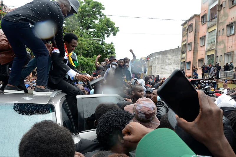 Mr Mondlane addressed supporters from the top of a vehicle in Maputo (Carlos Uqueio/AP)