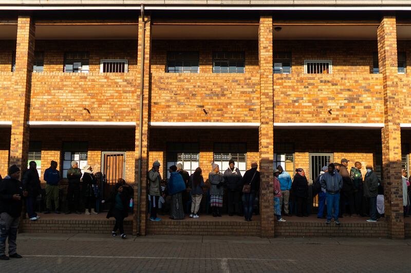 Voters line up to cast their ballot in general elections in Soweto (Jerome Delay/AP)