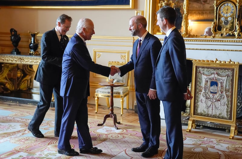 The King shakes hands with Business and Trade Secretary Jonathan Reynolds