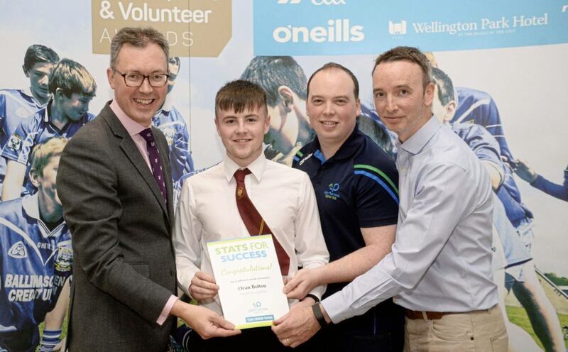 St Patrick&rsquo;s Grammar School, Downpatrick student Oran Bolton is presented with a Special Recognition Award for his contribution to the Irish News and Performa Sports Stats for Success initiative. Pictured from left to right is John Brolly of the Irish News, Oran Bolton, Danny and Joe Turley of Performa Sports.