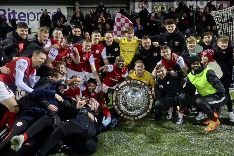 Larne players celebrate with the Co Antrim Shield after victory over Linfield at Seaview Picture by Colm Lenaghan/Pacemaker 