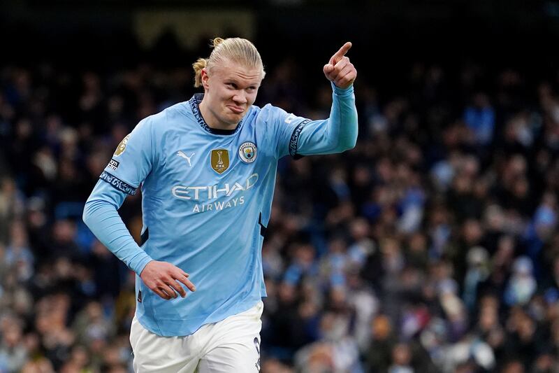 Erling Haaland celebrates his first goal