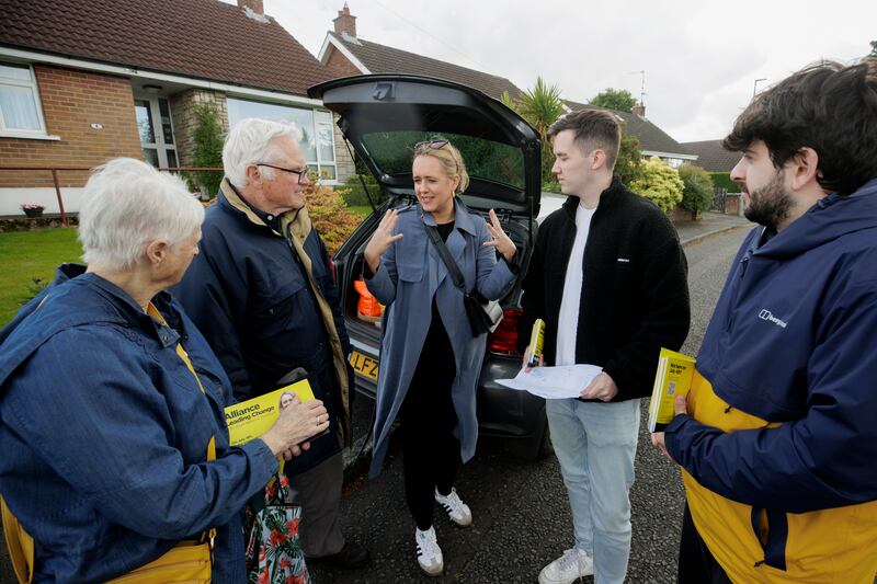 Kate Nicholl (centre), Alliance Westminster candidate for the constituency of South Belfast and Mid Down in Northern Ireland, speaking with her canvassing team in the Four Winds area of Belfast. Picture date: Monday June 10, 2024. PA Photo. See PA story POLITICS Election UlsterSouthBelfast. Photo credit should read: Liam McBurney/PA Wire