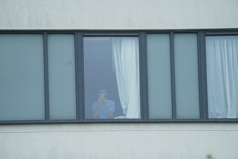 A man at the window of the Holiday Inn Express in Manvers Way, Rotherham, when the rioting was taking place